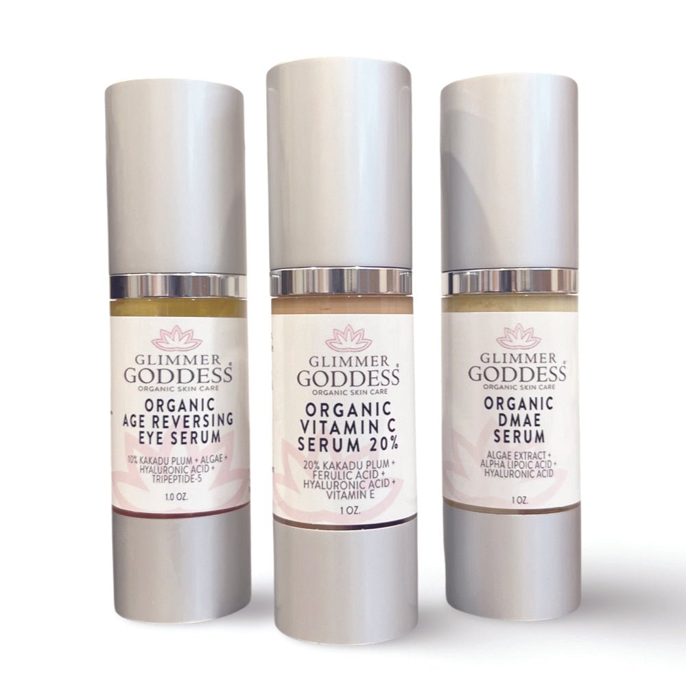 Three full-size organic anti-aging face and eye serums in dropper bottles for daily skincare
