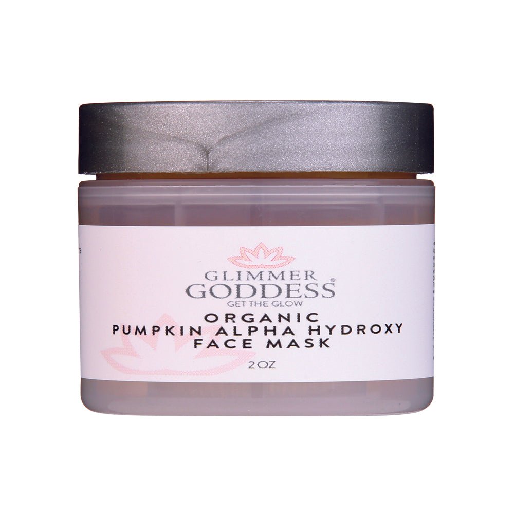 Orange organic pumpkin AHA exfoliating face mask in a glass jar for anti-aging skincare.