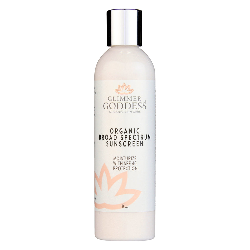 Organic reef-safe sunscreen SPF 40 in white squeeze tube bottle with natural pomegranate ingredients.