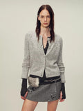 Heavy alpaca wool blend women's cardigan featuring hand-crocheted paisley embroidery and cloth-covered buttons.