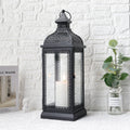 19 inch tall black rustic metal candle lantern with tempered glass panels and top hanging ring