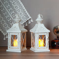 Set of two 11-inch white and gold brushed metal decorative candle lanterns with tempered glass panels