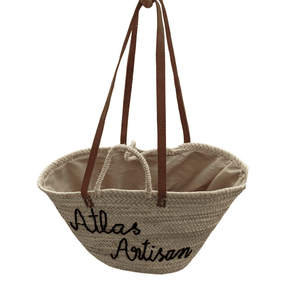 Handwoven natural wicker beach bag with leather shoulder handles and optional custom inscription
