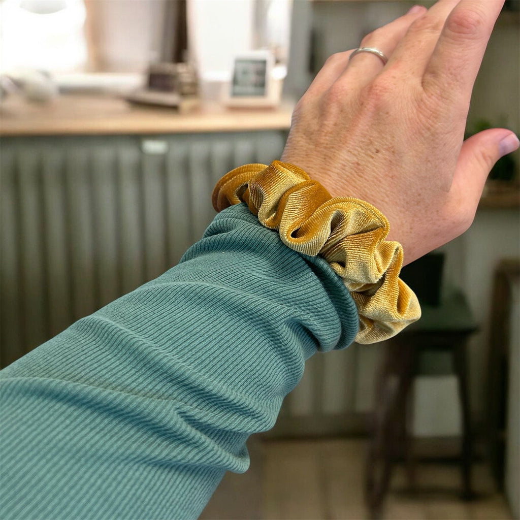 Plush velvet tranquil scrunchie hair tie infused with lavender, shown as a soft wrist accessory — view 4