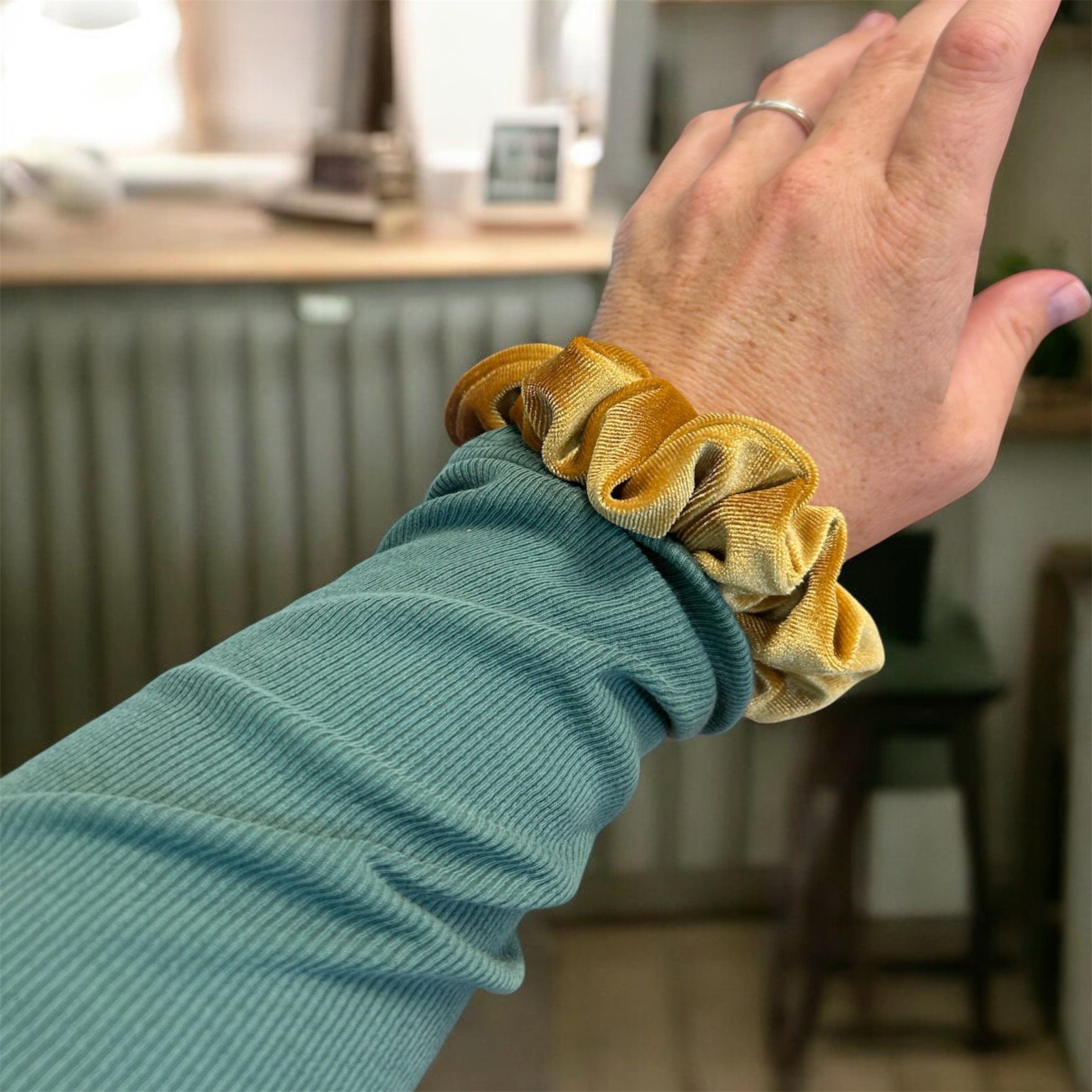 Plush velvet tranquil scrunchie hair tie infused with lavender, shown as a soft wrist accessory — view 4