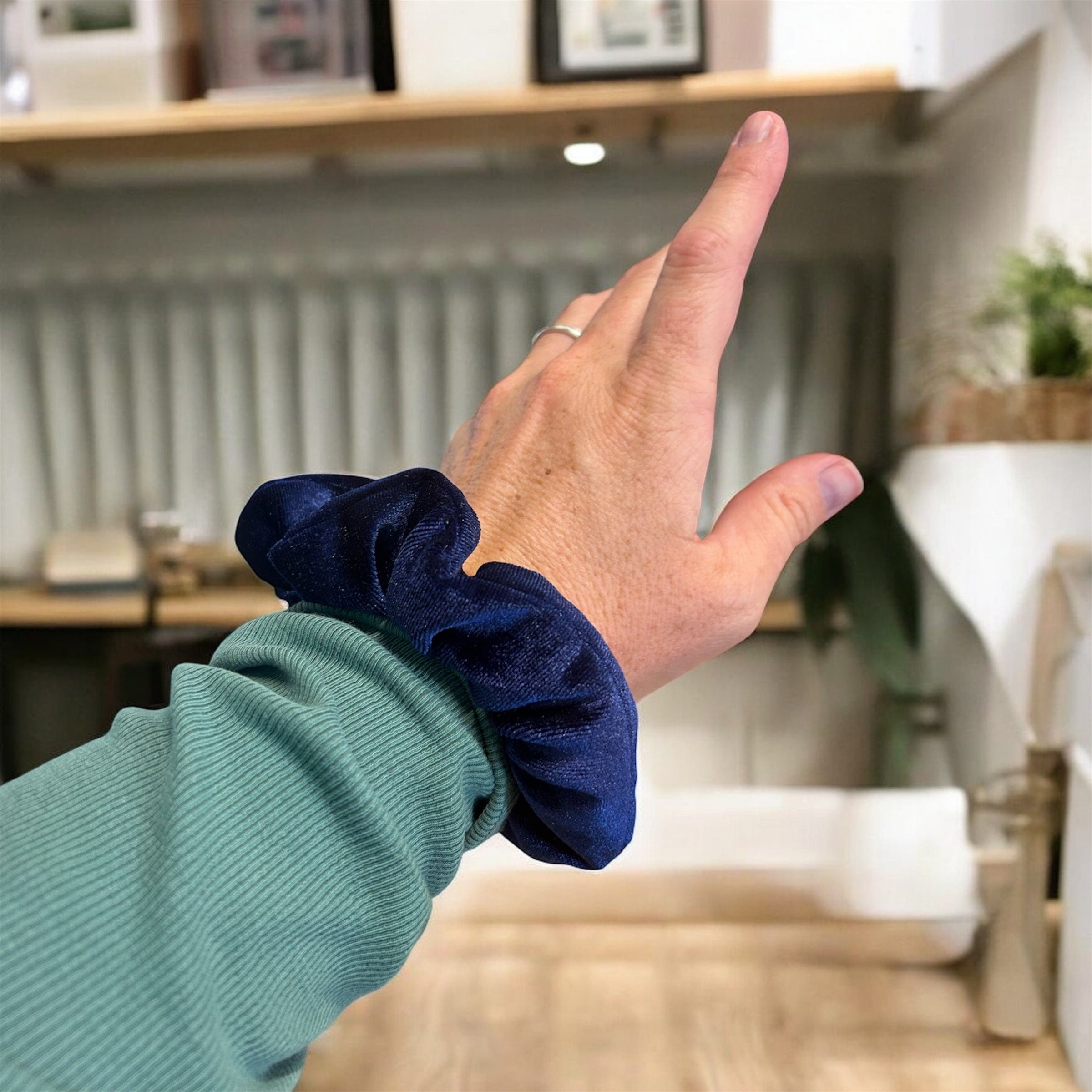 Plush velvet tranquil scrunchie hair tie infused with lavender, shown as a soft wrist accessory — view 3