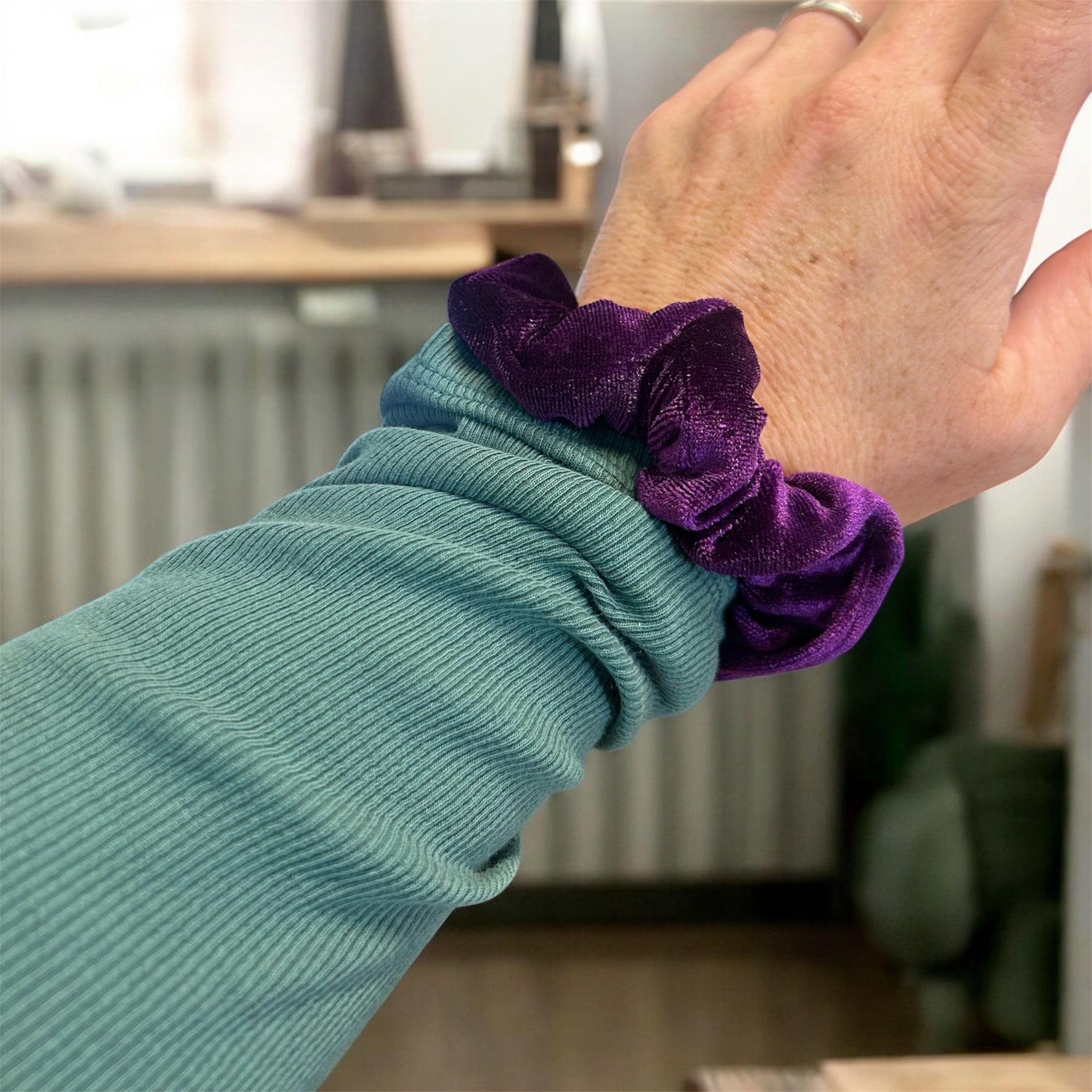 Plush velvet tranquil scrunchie hair tie infused with lavender, shown as a soft wrist accessory — view 2