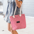 Striped canvas tote bag with zipper closure and spacious interior for women