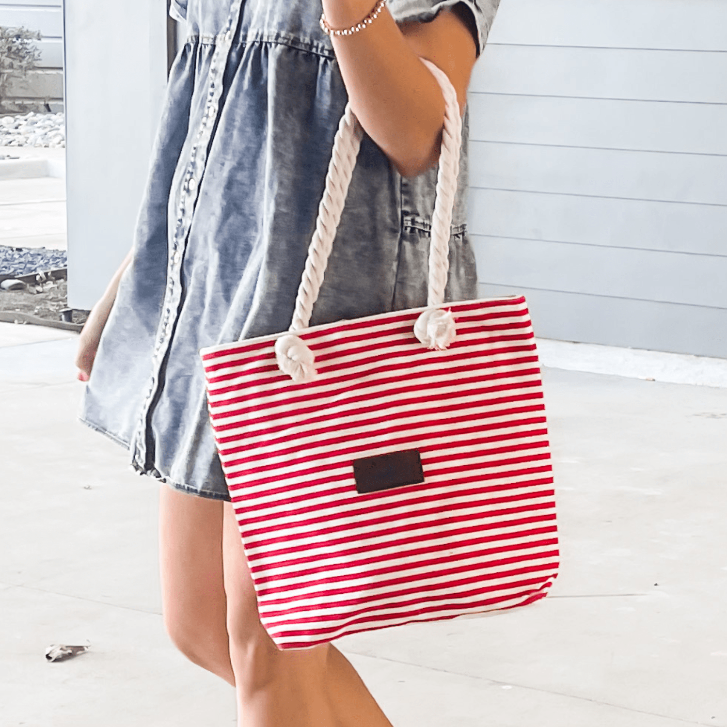 Striped canvas tote bag with zipper closure and spacious interior for women