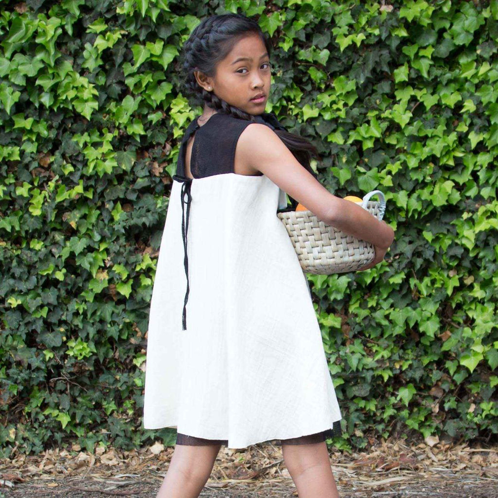 White baby doll dress for girls in organic cotton muslin with delicate black tulle details — view 3
