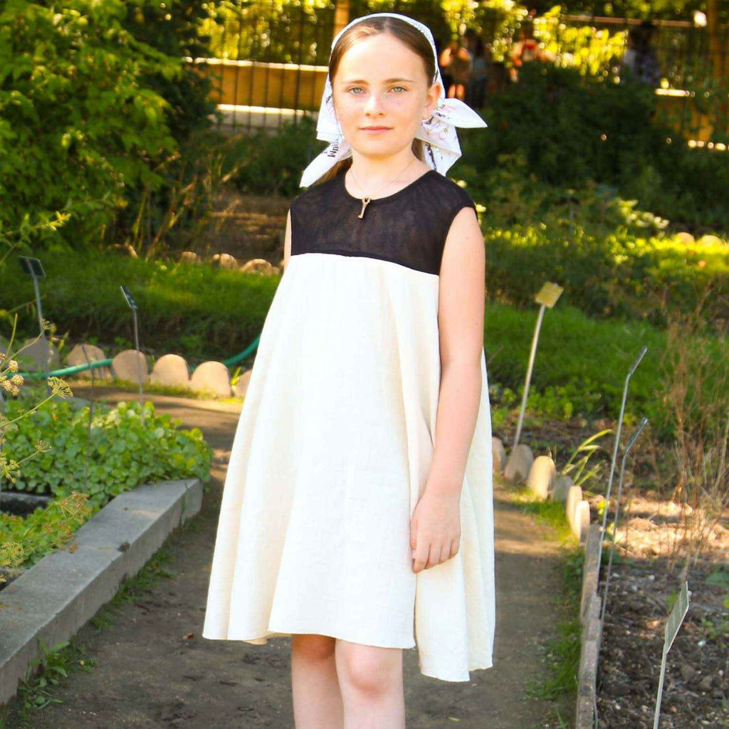 White baby doll dress for girls in organic cotton muslin with delicate black tulle details — view 4