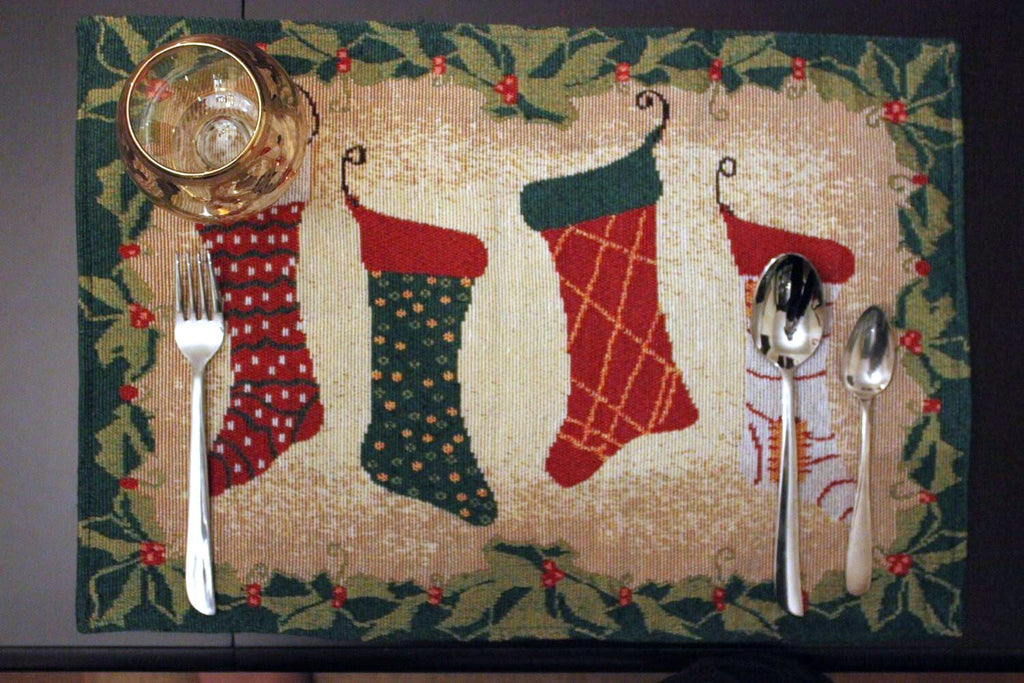 Festive woven holiday placemat set of four featuring Christmas stockings and gold thread accents