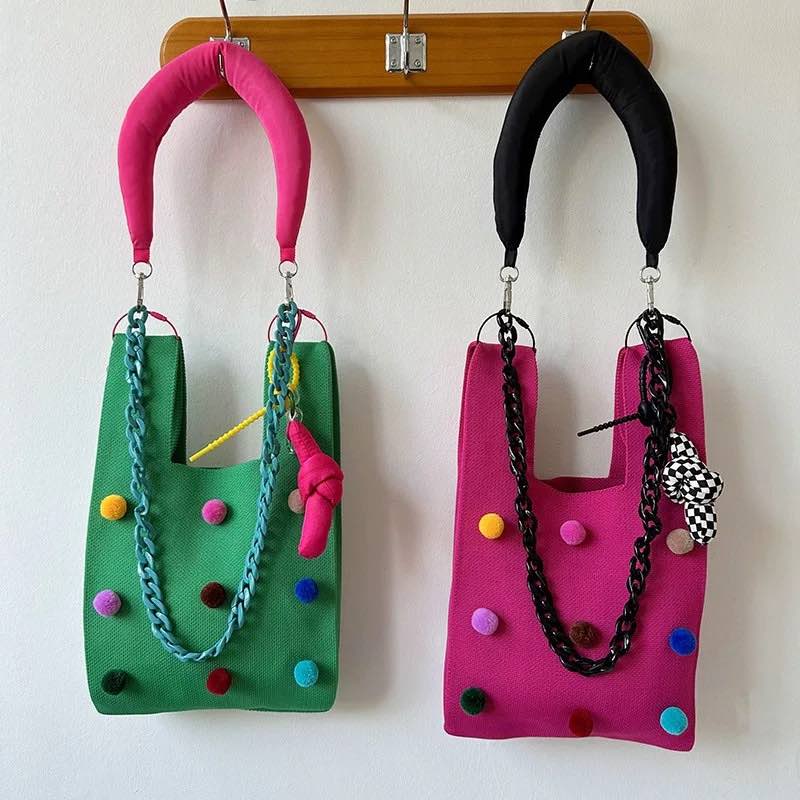 Whimsical pomponette knitted clutch bag in bright dopamine colors with a detachable shoulder strap