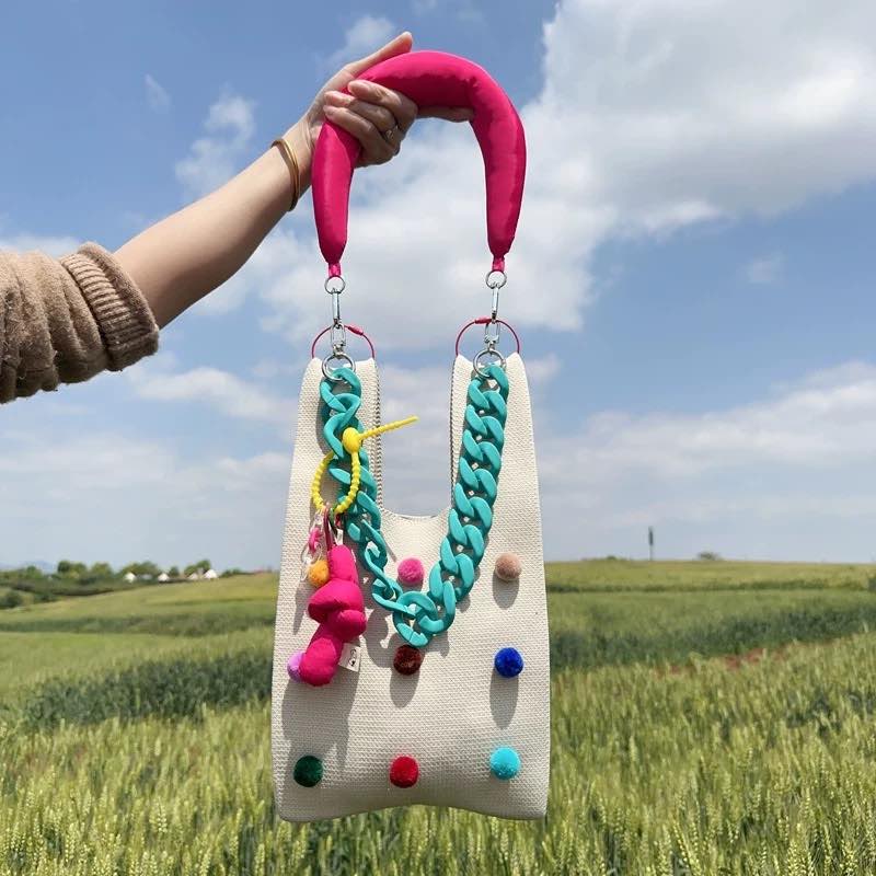 Whimsical pomponette knitted clutch bag in bright dopamine colors with a detachable shoulder strap — view 3