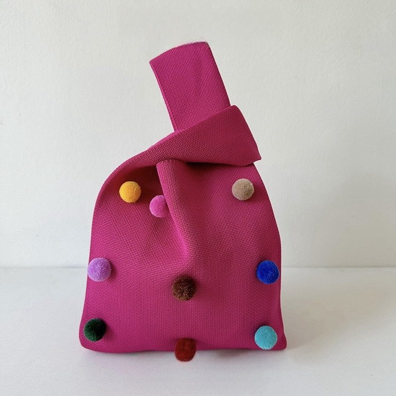 Whimsical pomponette knitted clutch bag in bright dopamine colors with a detachable shoulder strap — view 4