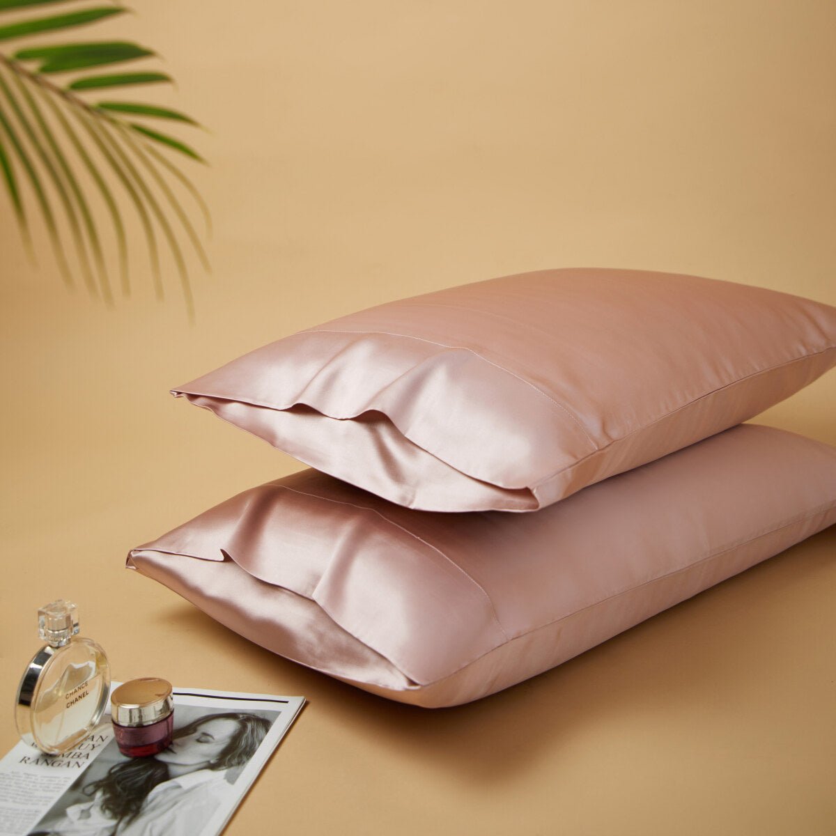 Premium mulberry silk reversible pillowcase duo folded neatly in a soft elegant bedroom setting — view 4