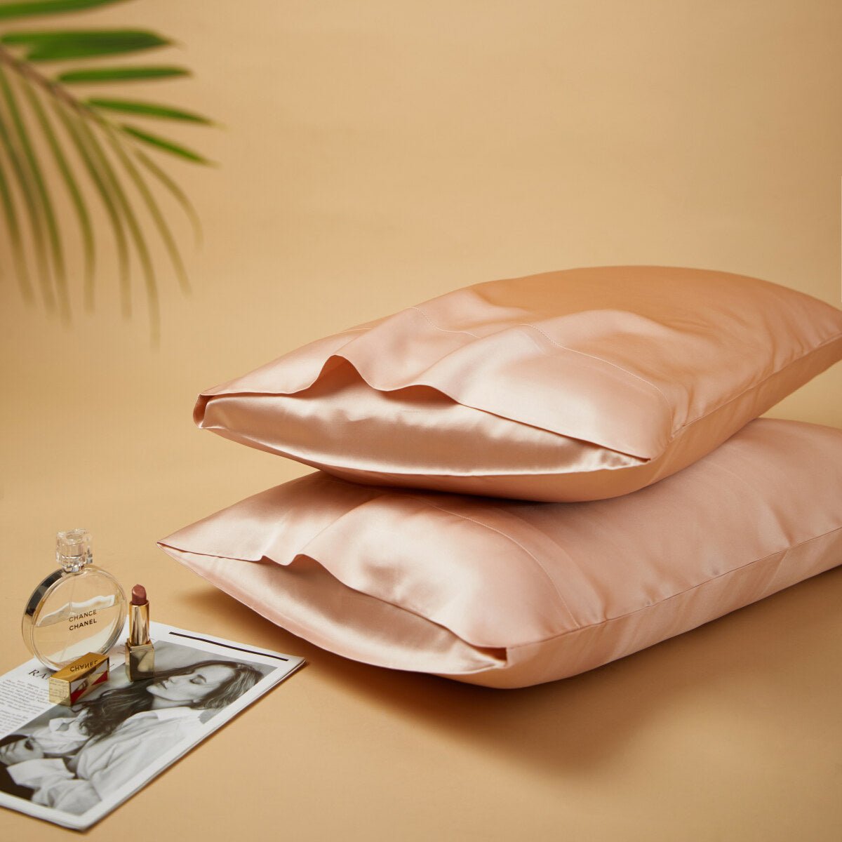 Premium mulberry silk reversible pillowcase duo folded neatly in a soft elegant bedroom setting — view 5