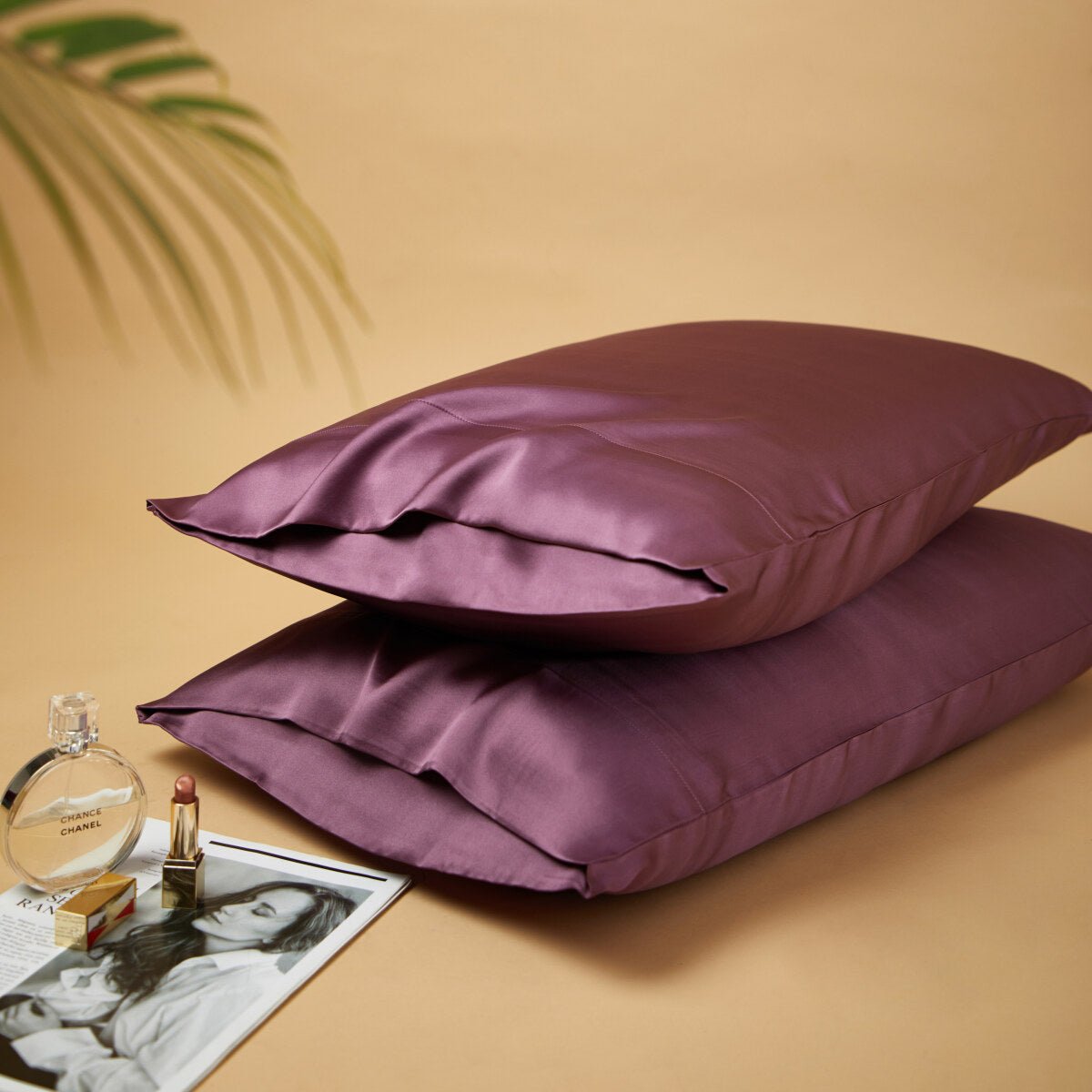 Premium mulberry silk reversible pillowcase duo folded neatly in a soft elegant bedroom setting — view 3