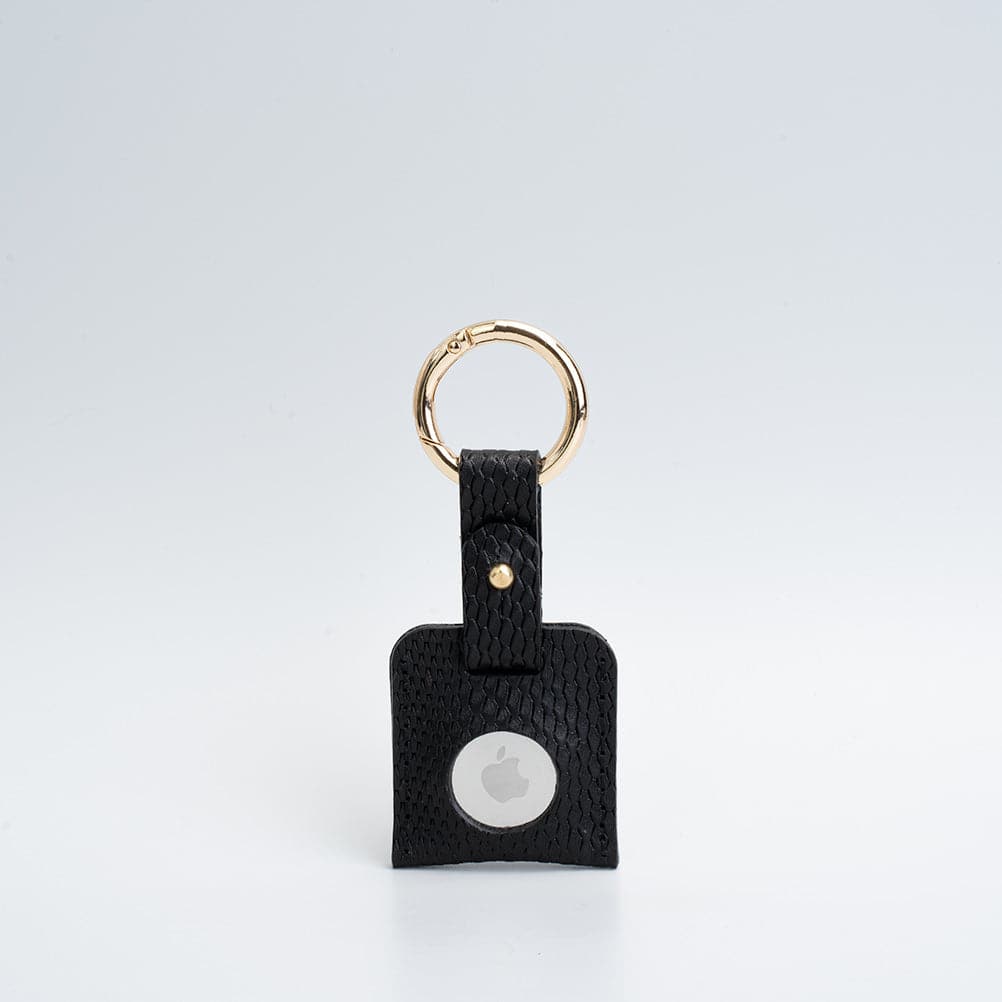 Leather AirTag keychain in premium full-grain leather with a sturdy metal circle carabiner — view 4