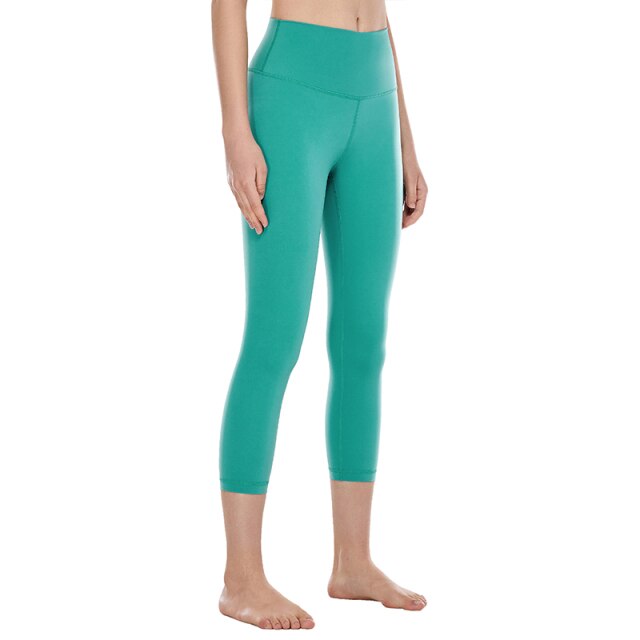 High waisted capri workout leggings offering a supportive calf-length athletic compression fit for women. — view 4