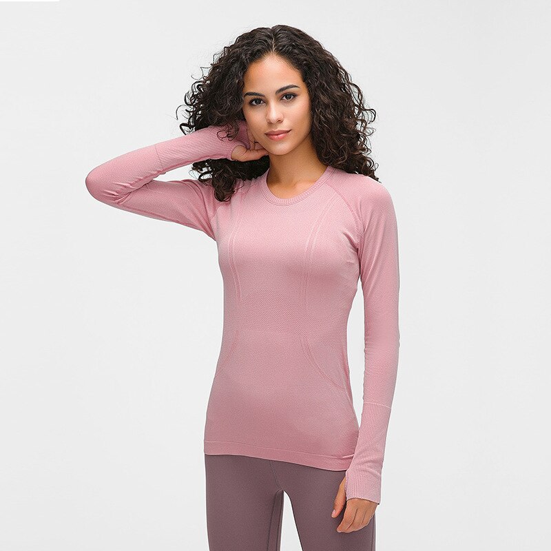 Seamless long sleeve women's yoga top with O-neck and thumb holes in athletic knit fabric