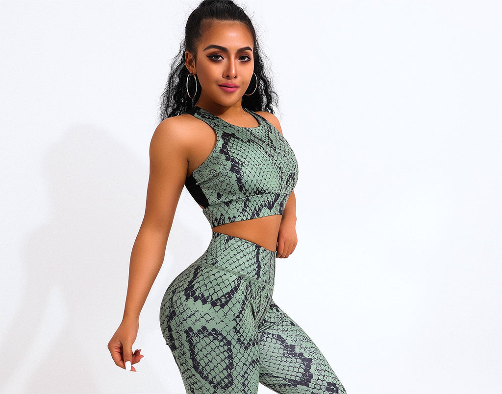 Two-piece snake print yoga set with green sleeveless sports bra and matching high-waisted fitness leggings — view 3