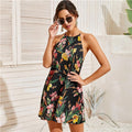 Boho floral halter dress in a multicolor botanical print on a sleeveless mini silhouette