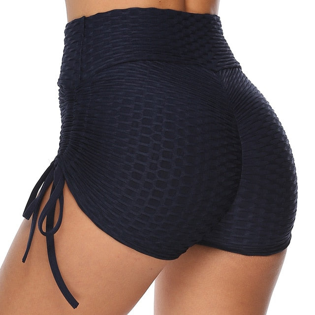 Women's black push-up workout shorts with elastic mid-waist and anti-cellulite textured fabric design — view 2