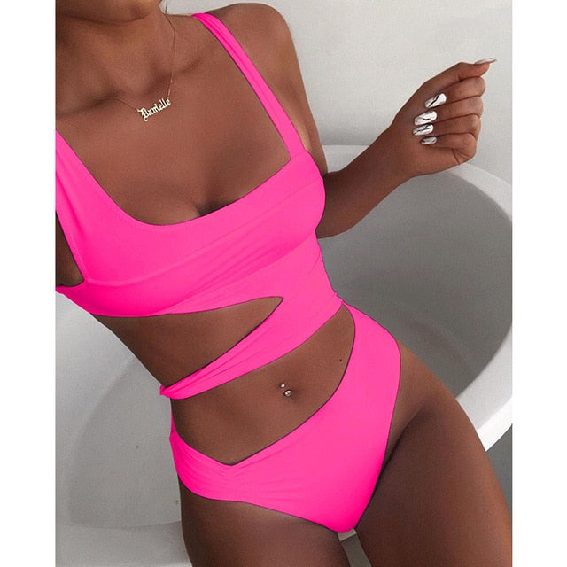 White cut-out one-piece swimsuit with push-up top and high-cut leg on a solid background — view 2