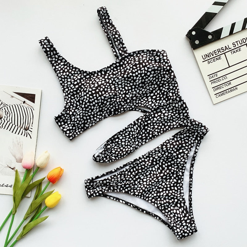 White cut-out one-piece swimsuit with push-up top and high-cut leg on a solid background — view 3