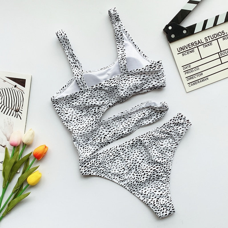 White cut-out one-piece swimsuit with push-up top and high-cut leg on a solid background — view 5