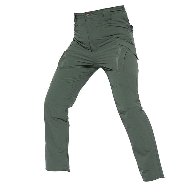 Mens lightweight tactical cargo pants in solid green with multiple utility pockets for outdoor hiking