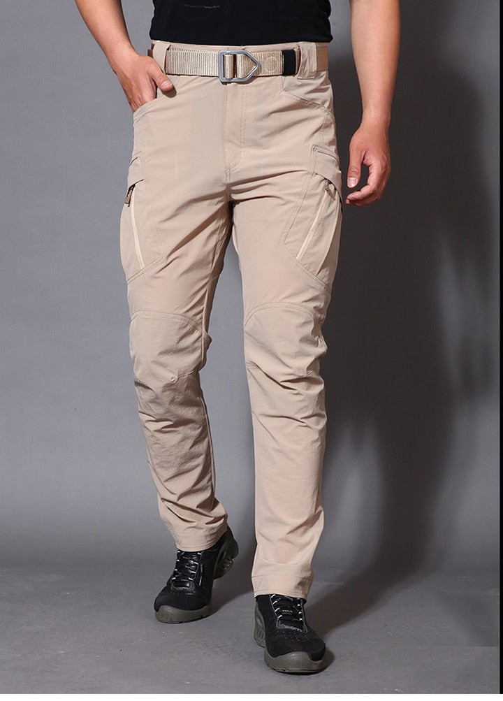 Mens lightweight tactical cargo pants in solid green with multiple utility pockets for outdoor hiking — view 5