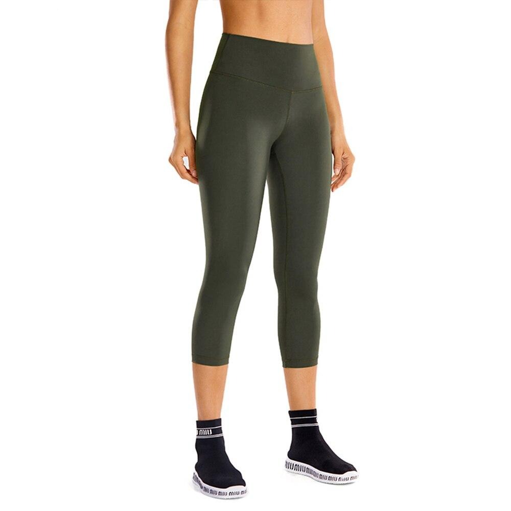 High waisted capri workout leggings offering a supportive calf-length athletic compression fit for women.