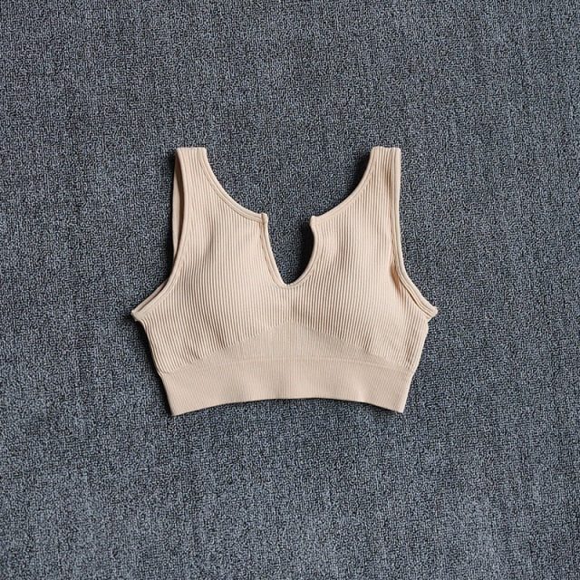 Seamless women's nylon sports bra crop top in various earthy colors with push up padding — view 3