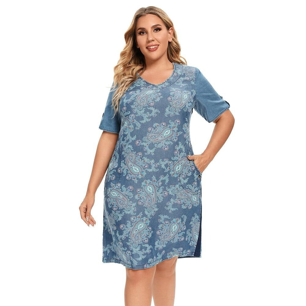 Plus size printed denim dress with V-neck, three-quarter sleeves, and front pockets. — view 3