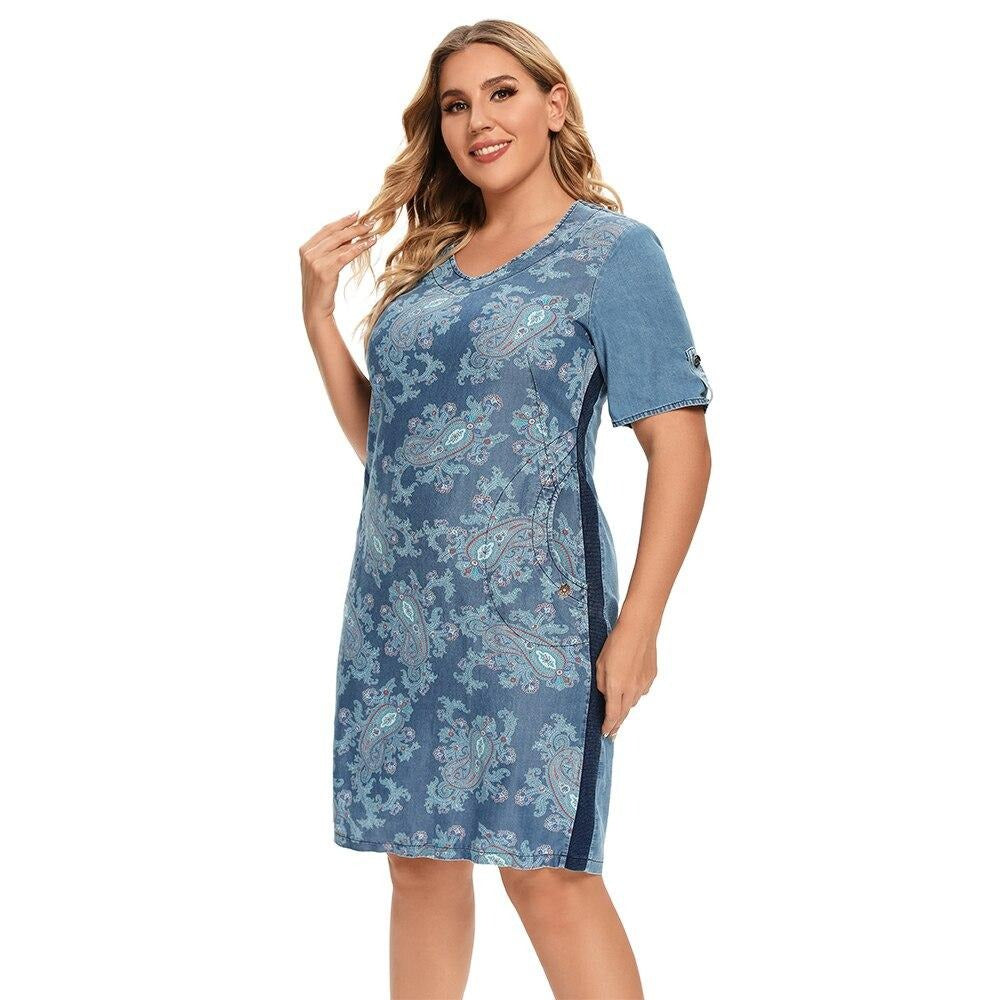 Plus size printed denim dress with V-neck, three-quarter sleeves, and front pockets. — view 4