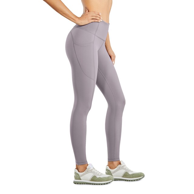 Women's compression training leggings with side pockets and high waist tummy control in solid color — view 2