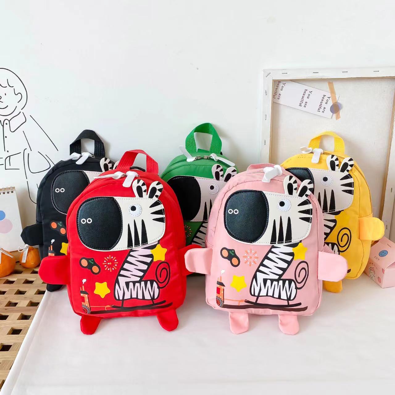 Kids Oxford cloth backpack with vibrant cartoon animal pattern and adjustable shoulder straps