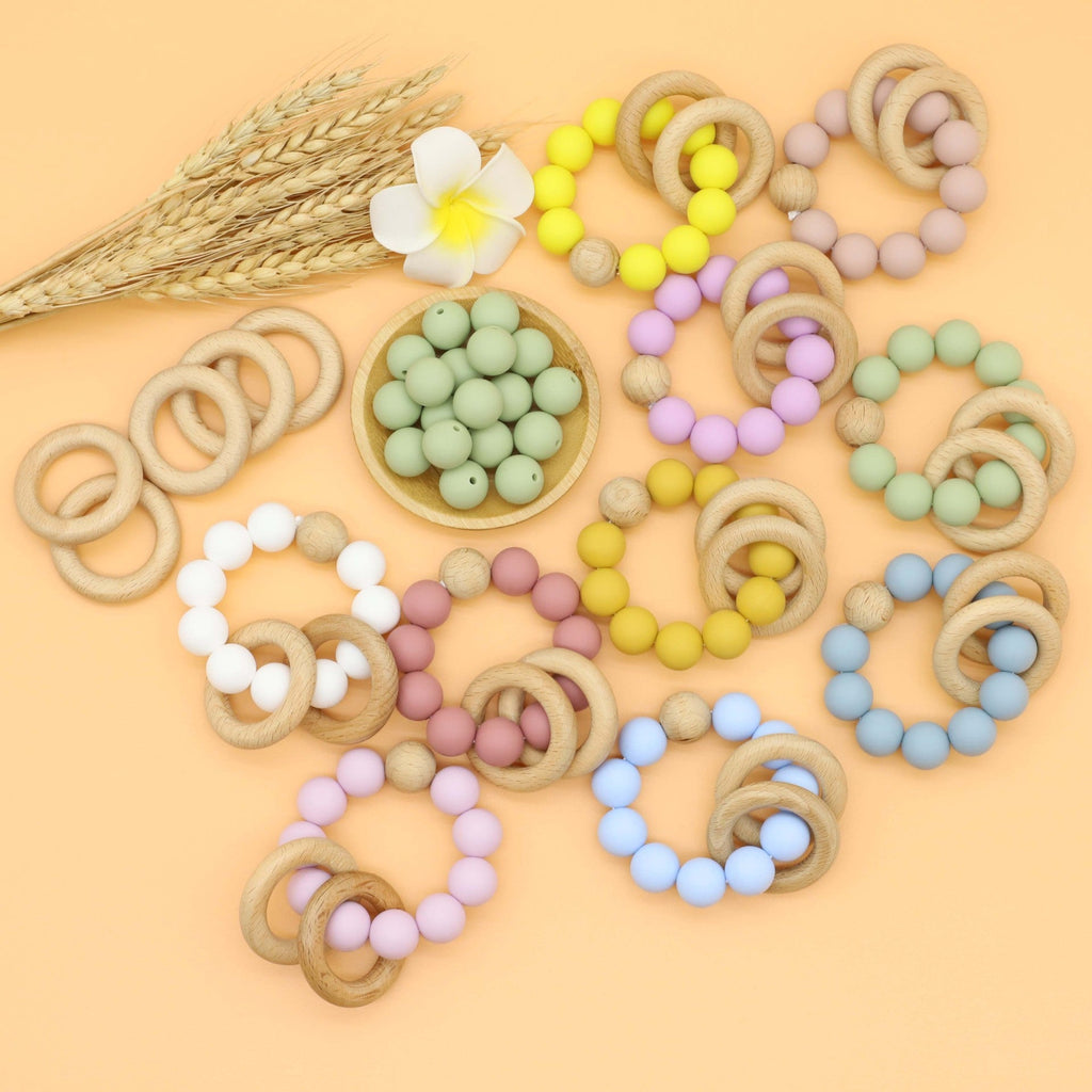 Multicolor silicone baby teether chain toy in bright rainbow colors for soothing gum relief.