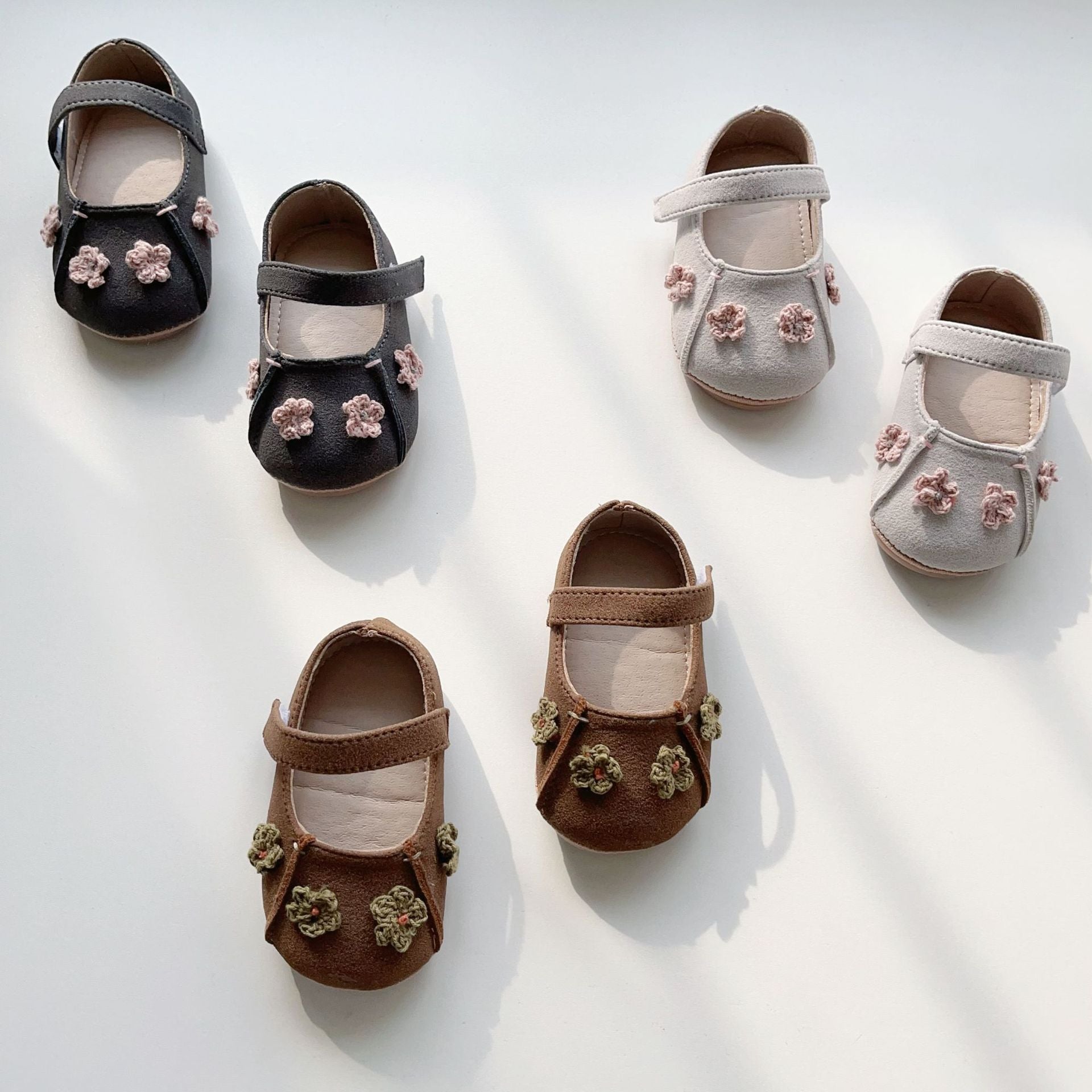 Soft-sole baby girl shoes with a floral pattern featuring anti-slip grips for early walking toddlers