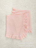 Solid color pure cotton knitted baby blanket featuring an elegant ruffle trim for stylish nursery decor