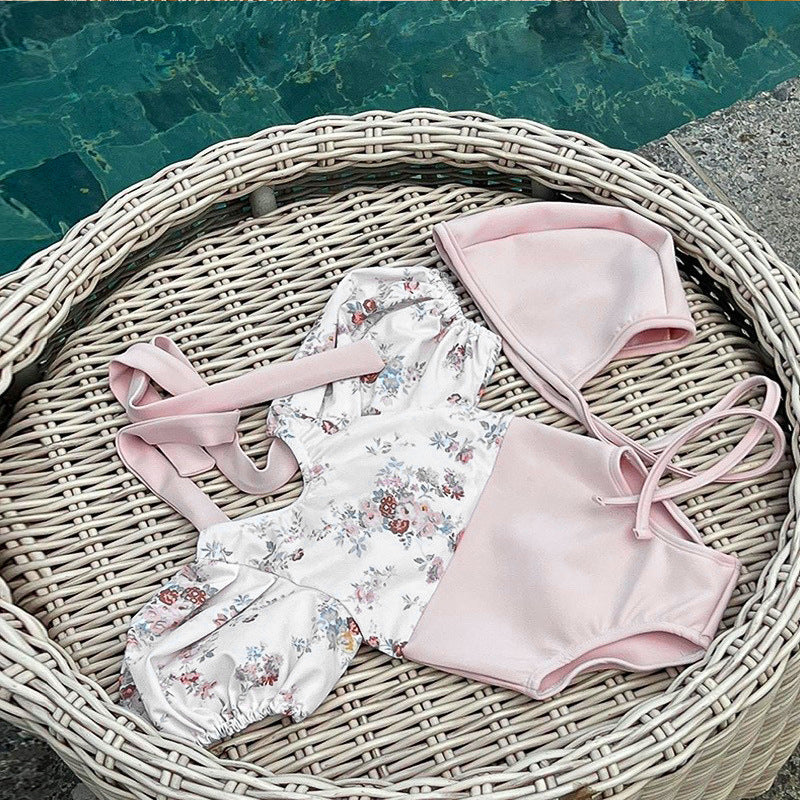 Baby girl pink floral swimwear set with puff sleeves and matching sun protection hat — view 2