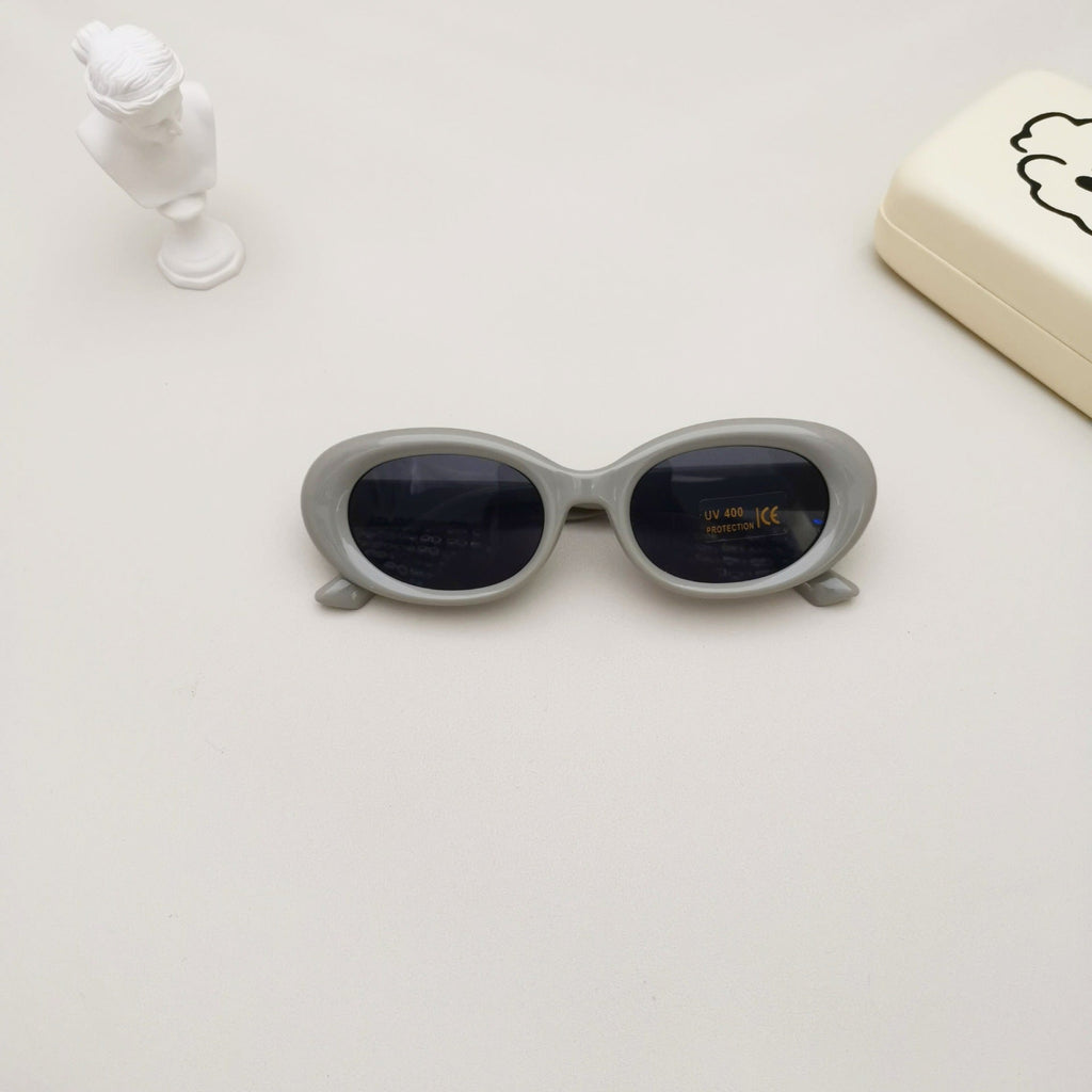 Kids oval beach sunglasses in solid colors featuring lightweight polycarbonate frames and UV protective lenses — view 4