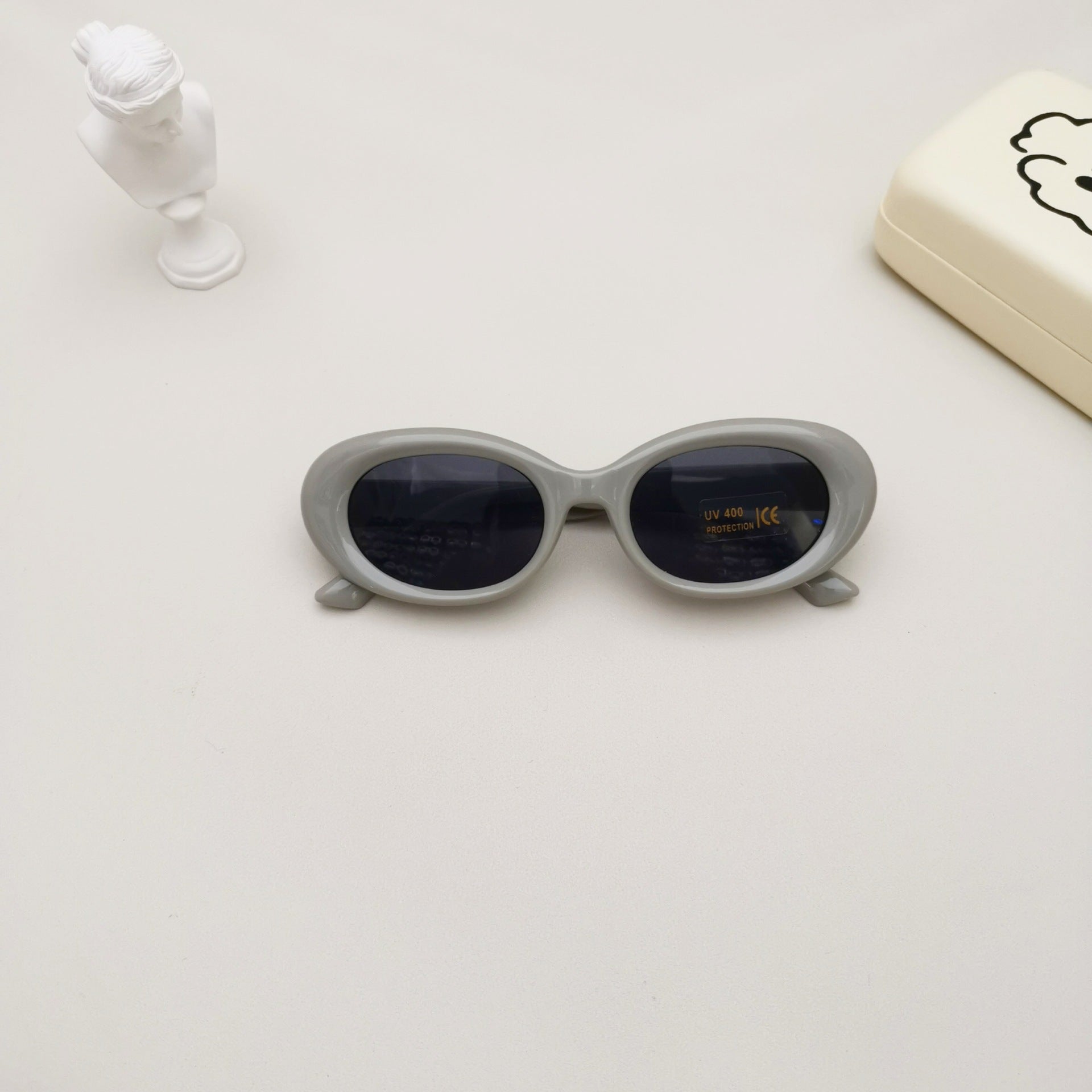 Kids oval beach sunglasses in solid colors featuring lightweight polycarbonate frames and UV protective lenses — view 4