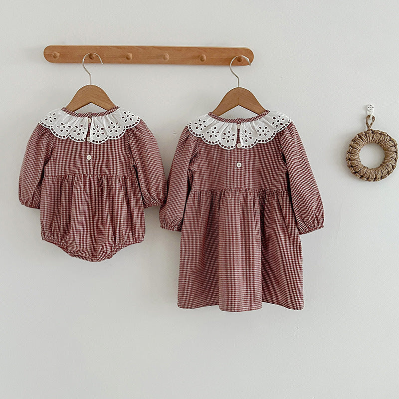 Red and brown plaid long sleeve baby bodysuit dress featuring a white fashion lace collar. — view 2