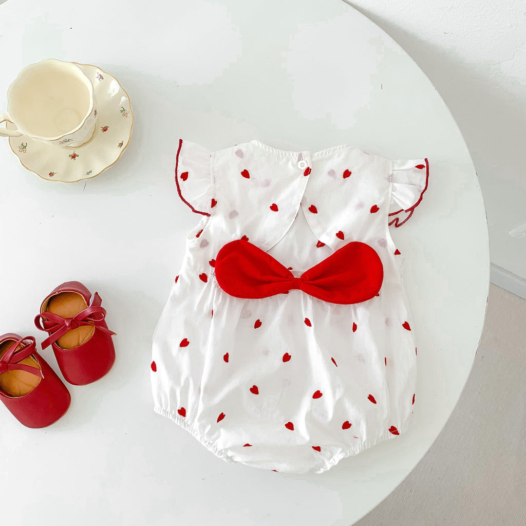 Baby girls beige summer bodysuit featuring a red heart print and delicate flutter fly sleeves. — view 2