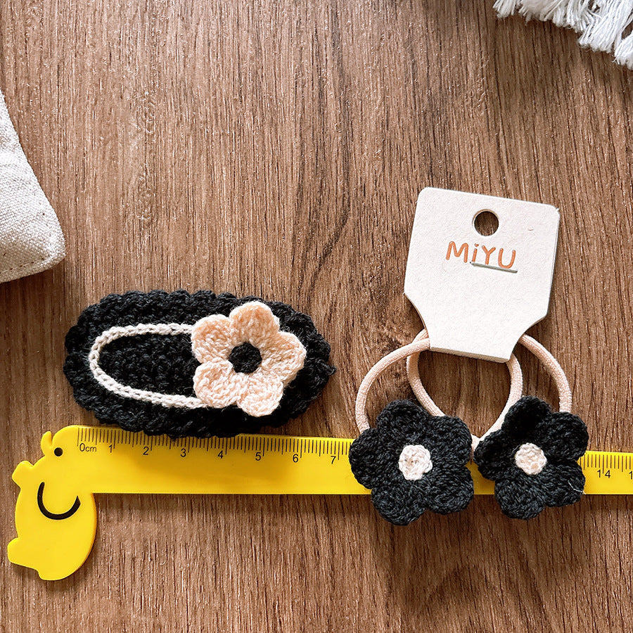 Knitted flower baby hair clips in soft cloth material for taming delicate stray hairs — view 2