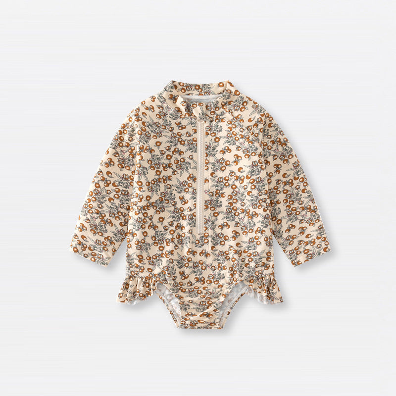 Baby girls zip-up swimwear in earthy floral and polka dot patterns with front zipper detail — view 3