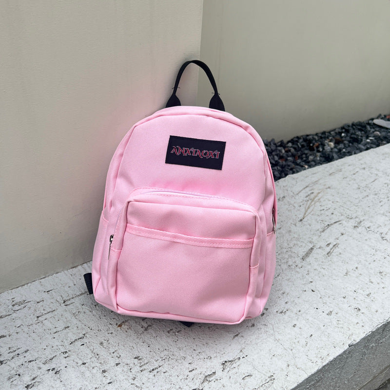 Lightweight children's canvas backpack with letter pattern available in multiple vibrant colors — view 2